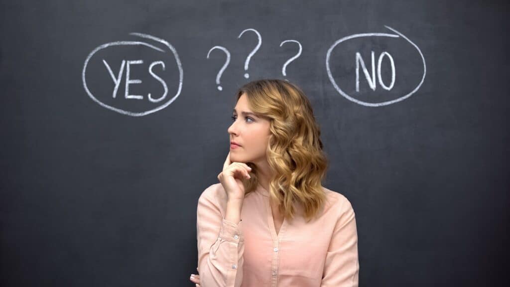 Puzzled woman choosing between yes no