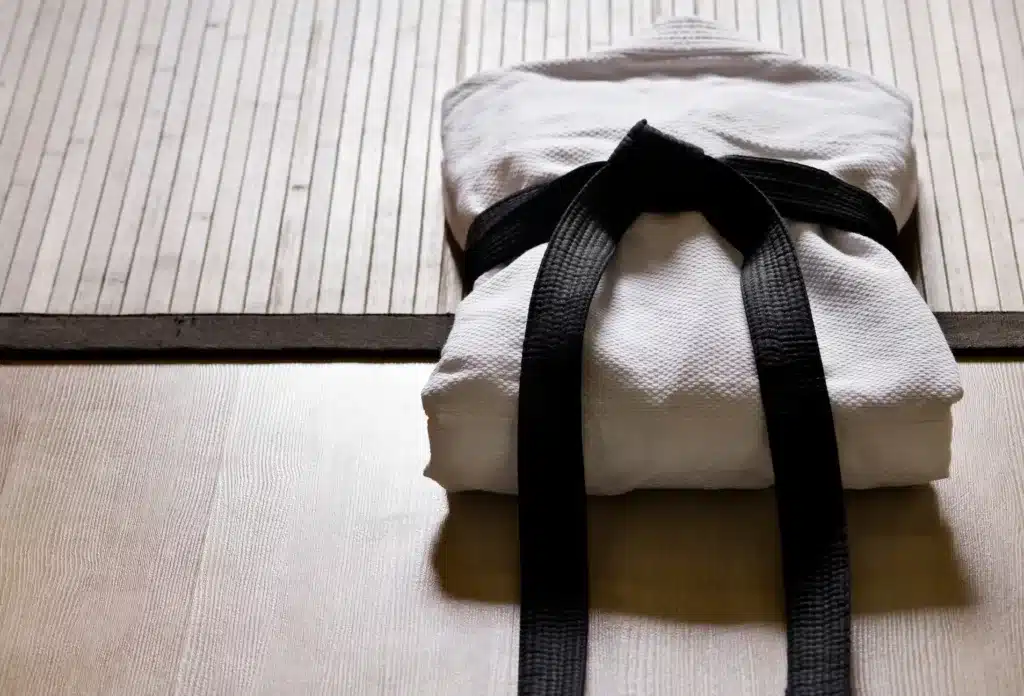 neatly wrapped kimono with a black belt wrapped around it